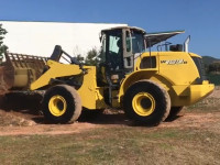 New Holland Фронтальный погрузчик New Holland W190B (24 часа)