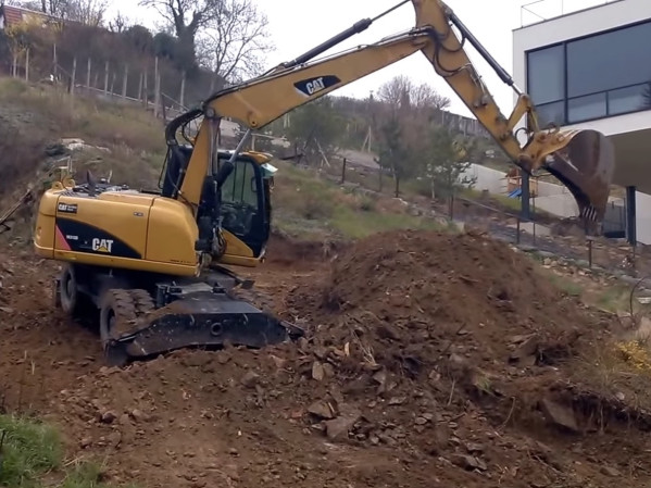 Полноповоротный экскаватор CAT M313C